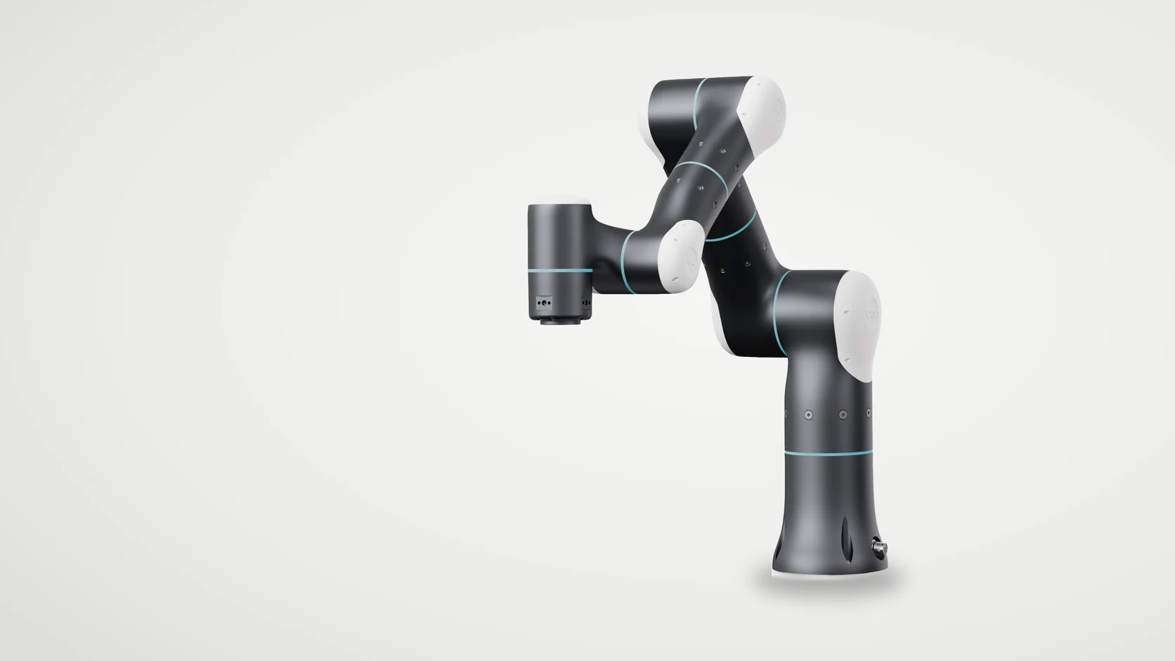 A dark grey and white six-axis collaborative robot arm on a light studio background